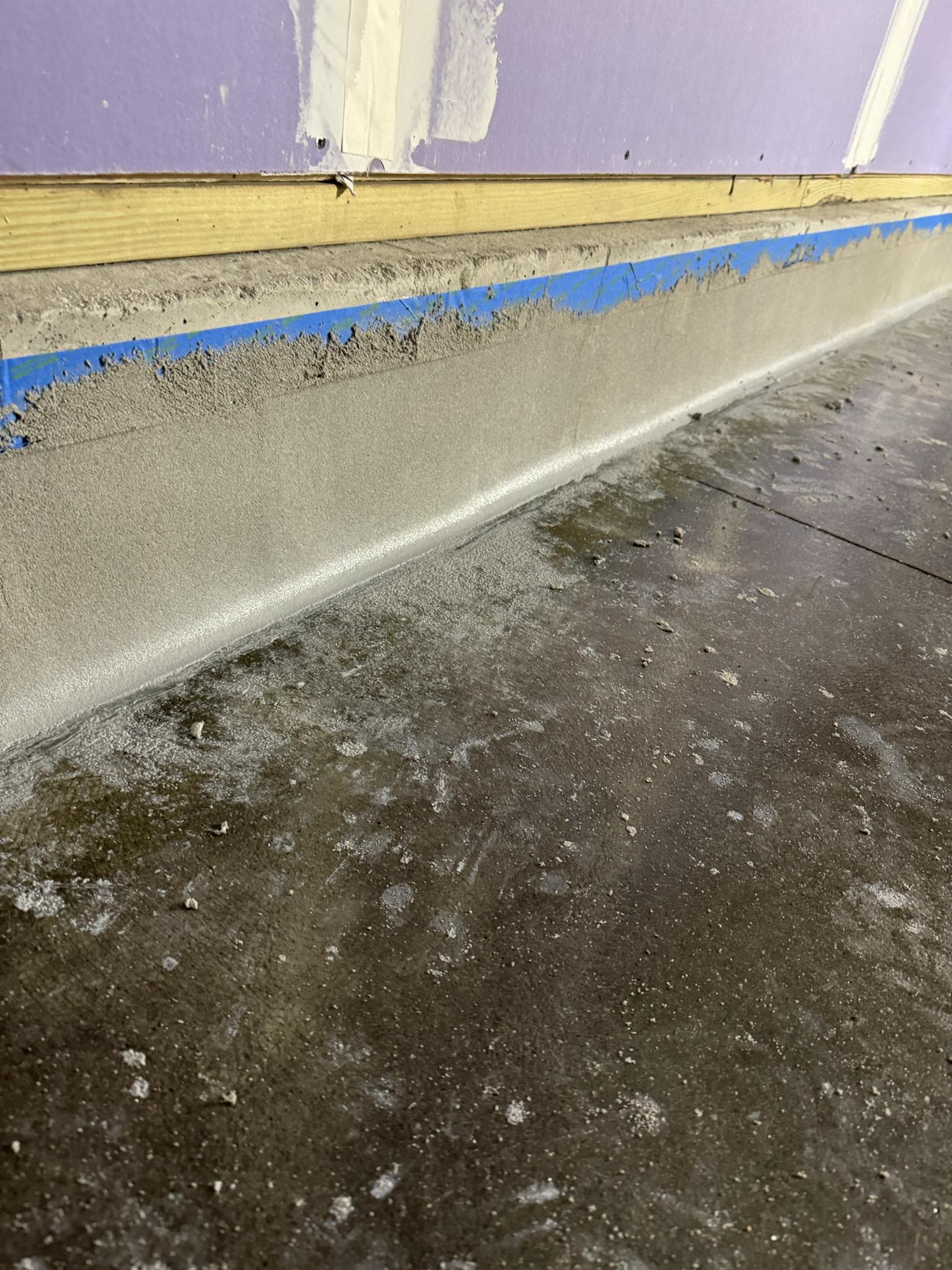 Epoxy cove base flooring installation by Epoxy Designs