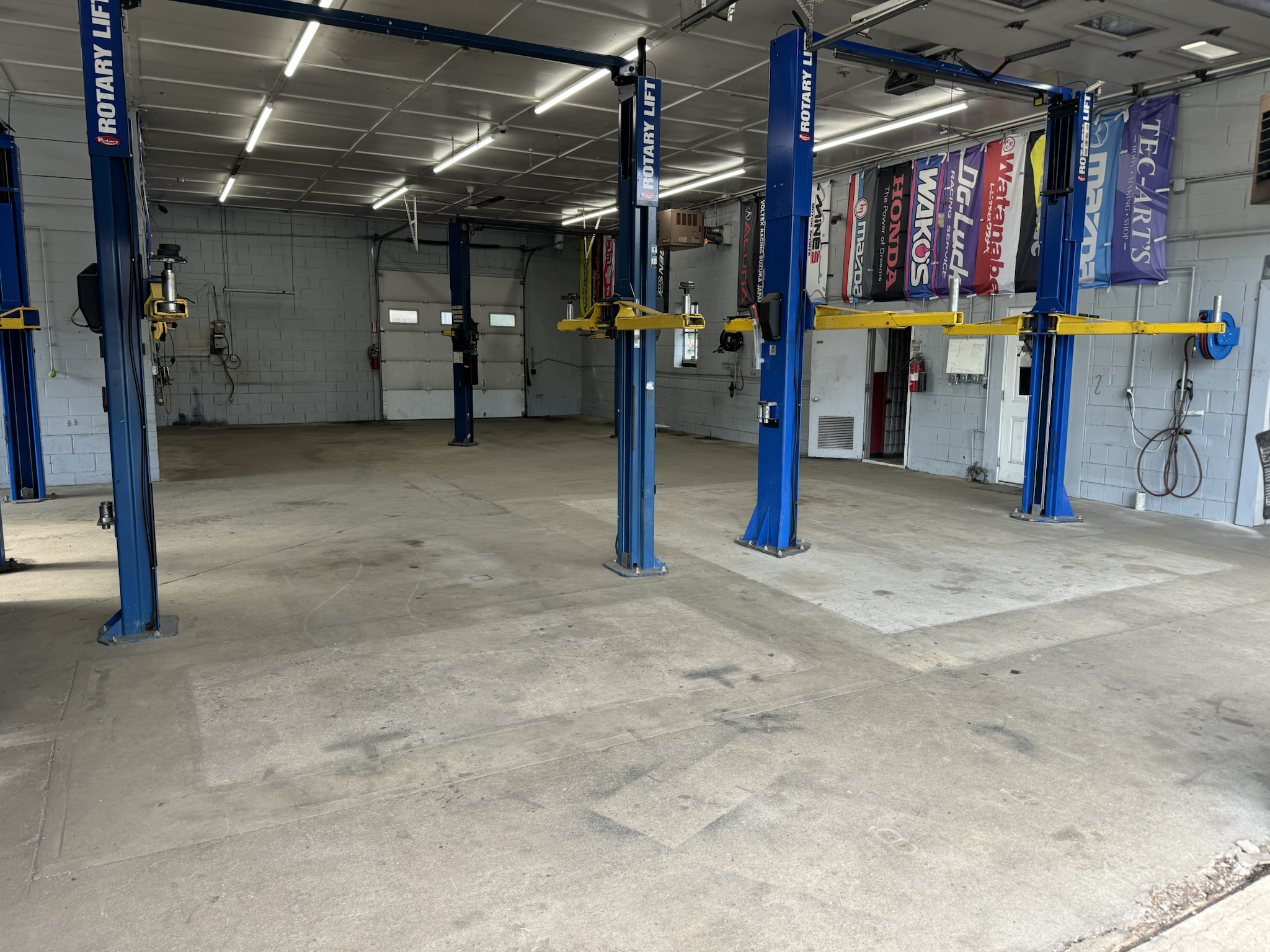 Auto shop — before (bare concrete)