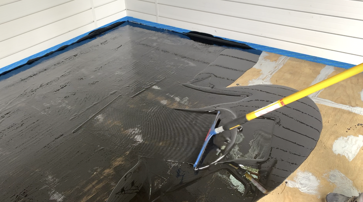 Wood floor coating installation by Epoxy Designs